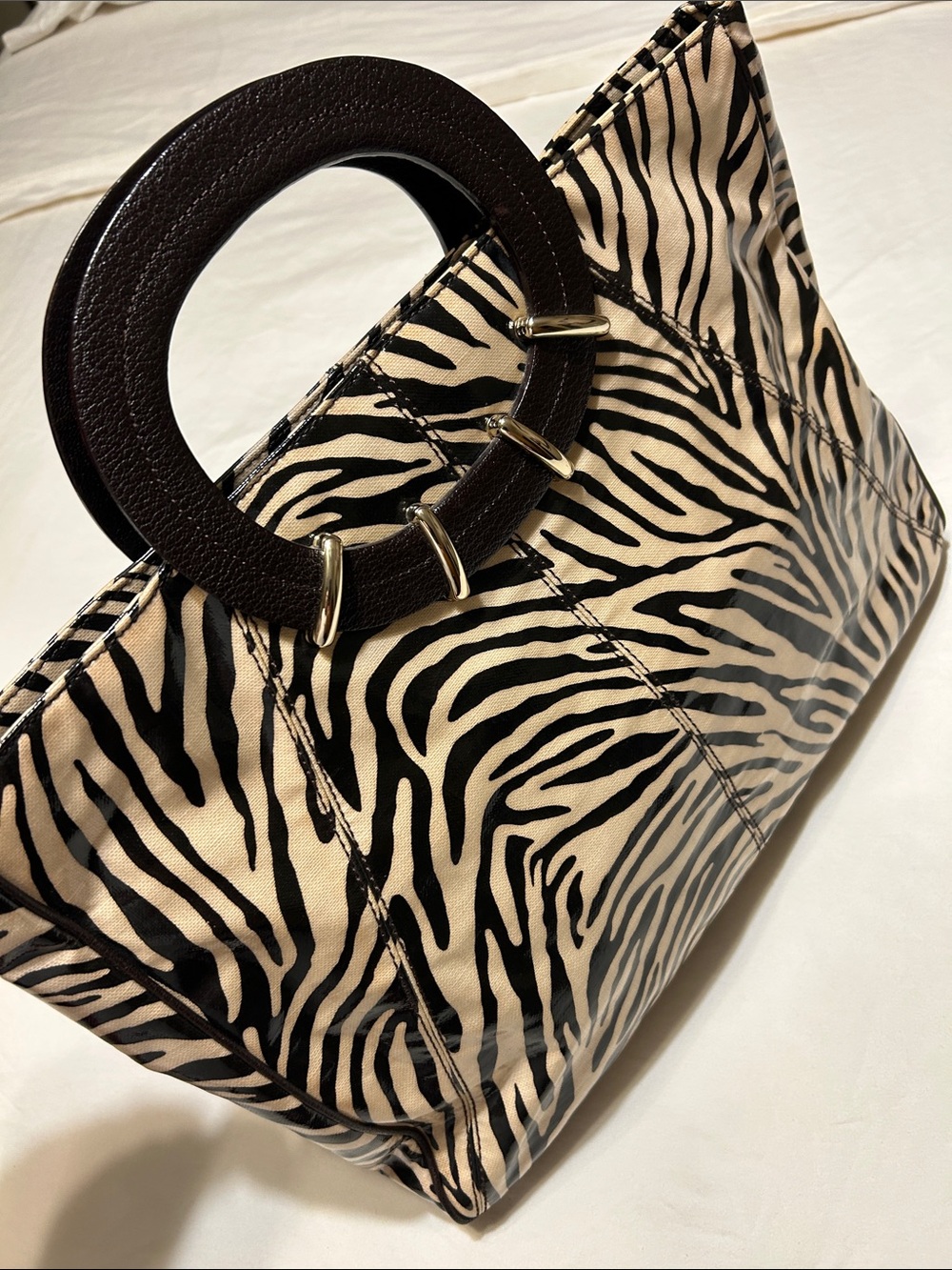 kate spade Black and Cream Zebra-Print Clutch with Round Dark Brown Handle